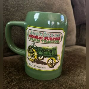 Green John Deere coffee cup